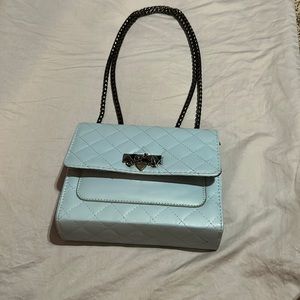 Light blue thrifted quilted crossbody with black chain clutch